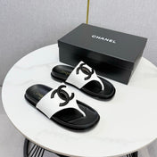CHANEL 26S CC THONG SLIDES IN WHITE AND BLACK LAMBSKIN