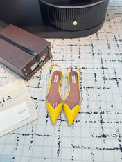 ALAIA FLAT SLINGBACK IN YELLOW PATENT CALFSKIN AND FILM