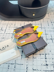ALAIA FLAT SLINGBACK IN YELLOW PATENT CALFSKIN AND FILM