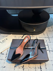 ALAIA HIGH SLINGBACK 25S 90 MM IN BLACK CALFSKIN