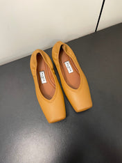 ALAIA BALLET FLATS IN COPPER BROWN SMOOTH CALFSKIN