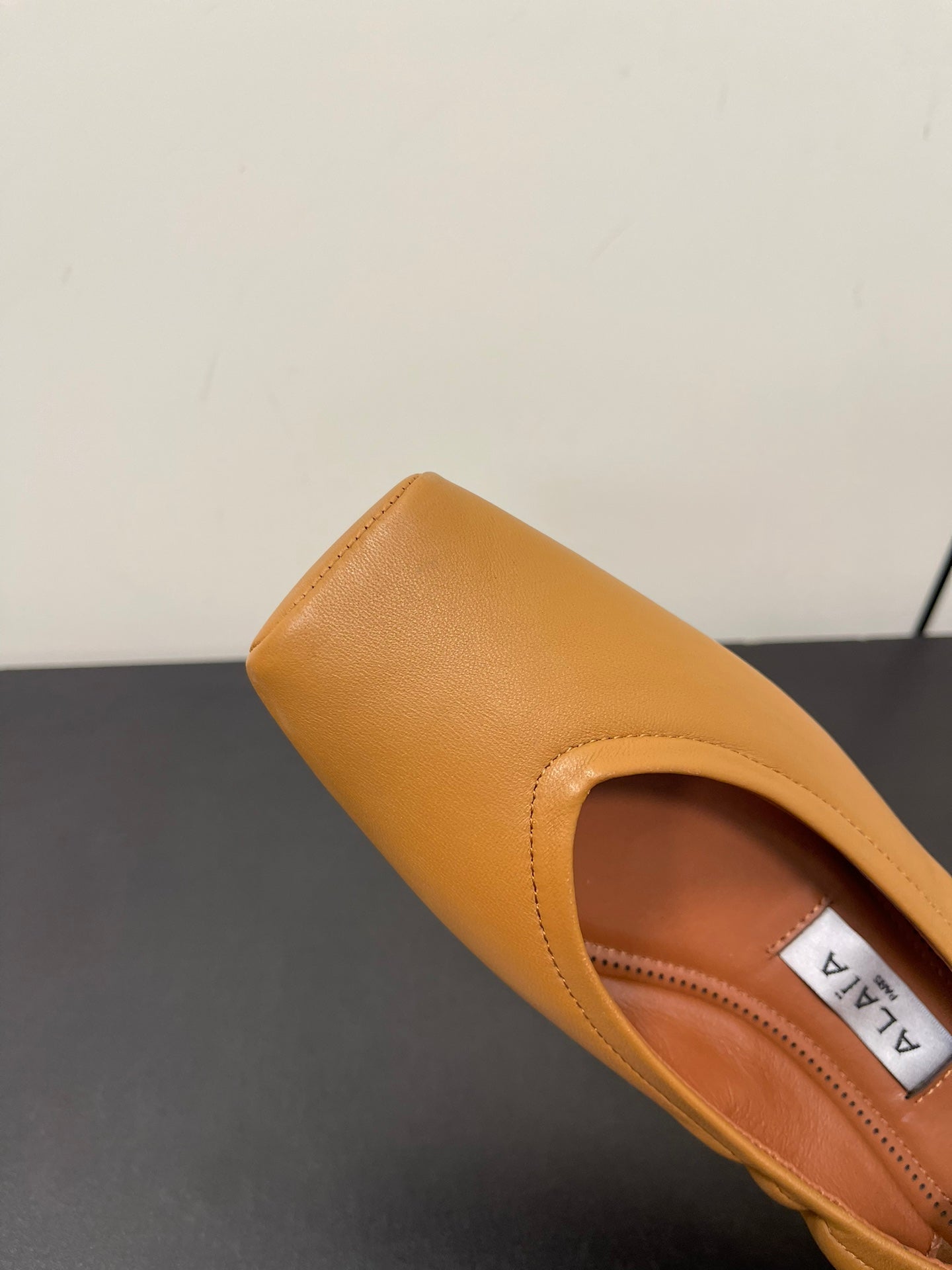 ALAIA BALLET FLATS IN COPPER BROWN SMOOTH CALFSKIN