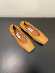 ALAIA BALLET FLATS IN COPPER BROWN SMOOTH CALFSKIN
