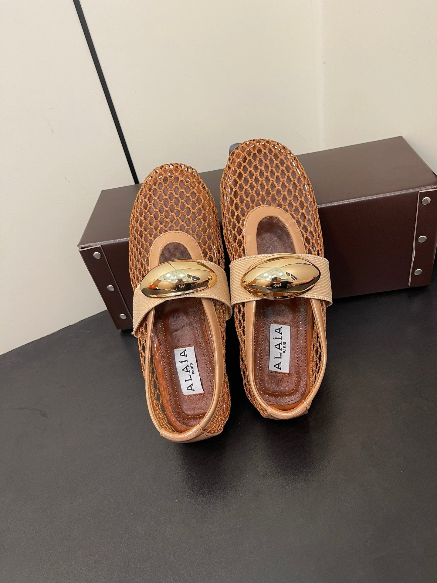 ALAIA BALLET FLATS IN COPPER BROWN MESH FISHNET WITH GOLD HARDWARE