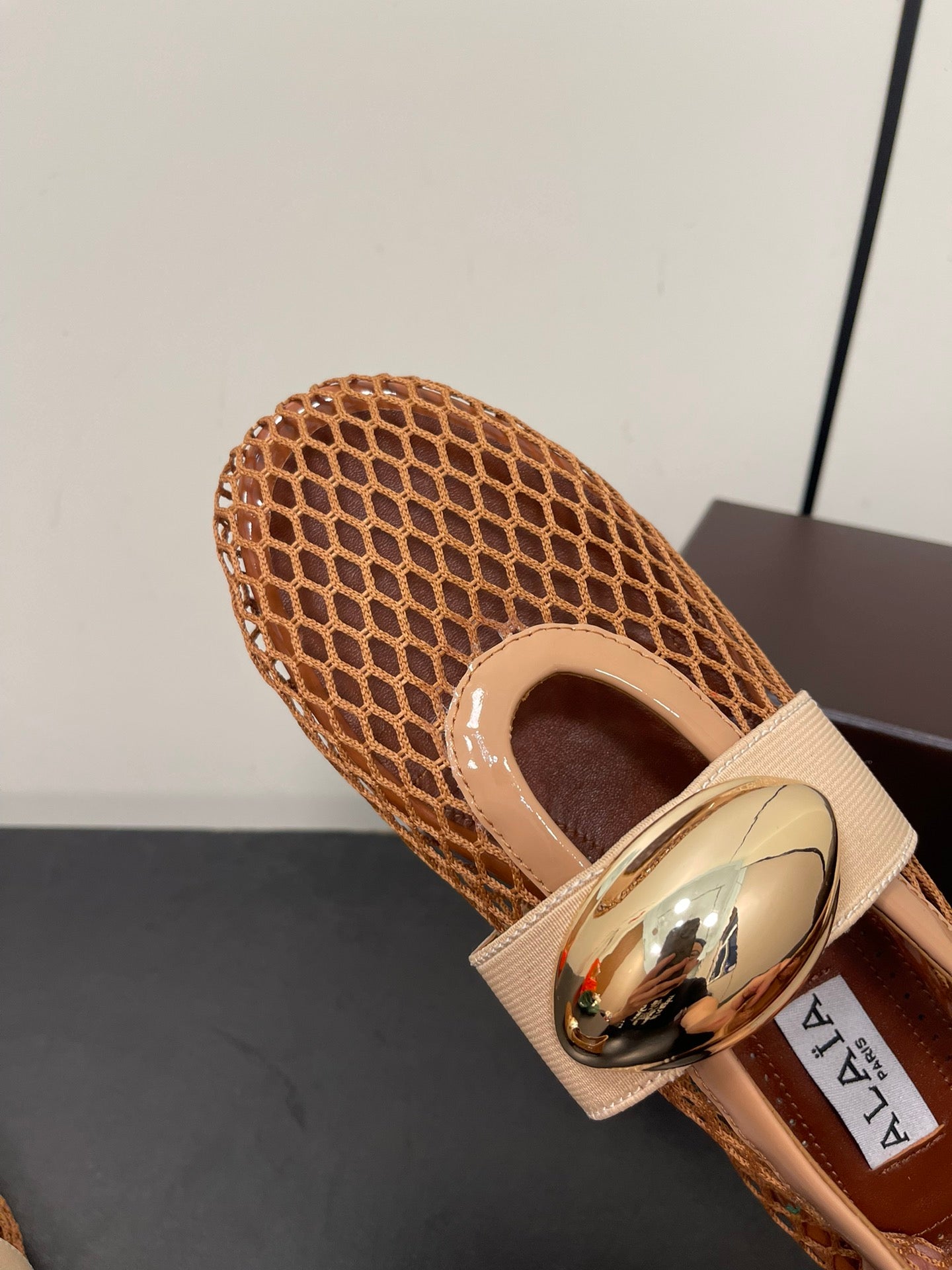 ALAIA BALLET FLATS IN COPPER BROWN MESH FISHNET WITH GOLD HARDWARE