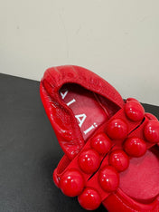 ALAIA SPHERE BALLET FLATS IN CHERRY RED LAMBSKIN