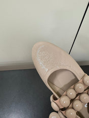 ALAIA SPHERE BALLET FLATS IN ALMOND BEIGE LAMBSKIN