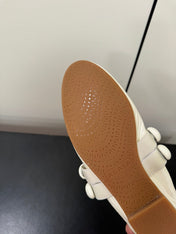 ALAIA SPHERE BALLET FLATS IN WHITE LAMBSKIN