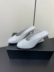 ALAIA WEDGE MULES 25S IN WHITE LAMBSKIN