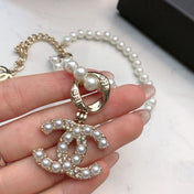 CHANEL 26S CHANEL CC LOGO PEARL BEADED NECKLACE WITH CHARM DETAIL IN GOLD METAL 633323
