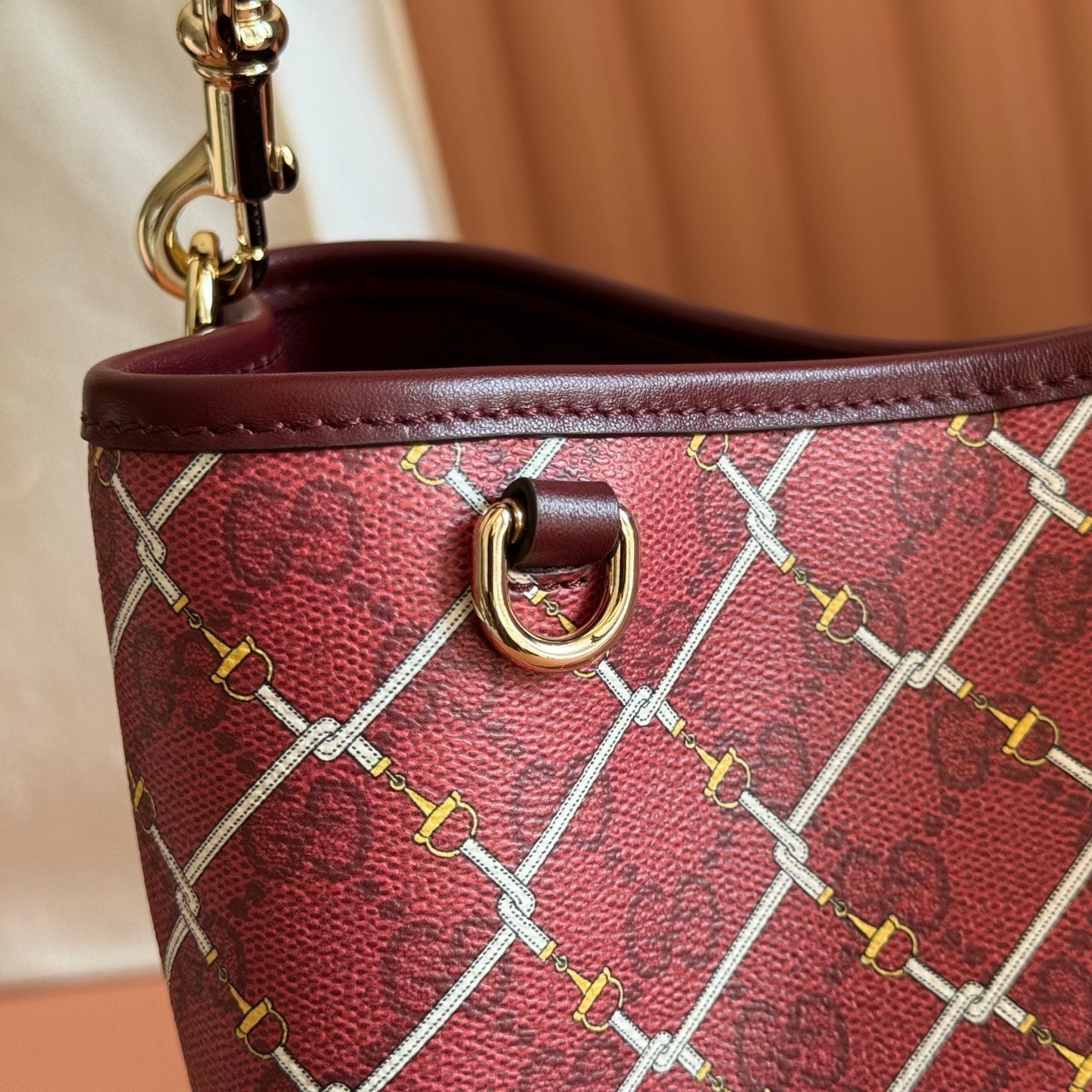 GUCCI 26S GG EMBLEM BUCKET BAG 25 IN DARK RED COATED FABRIC