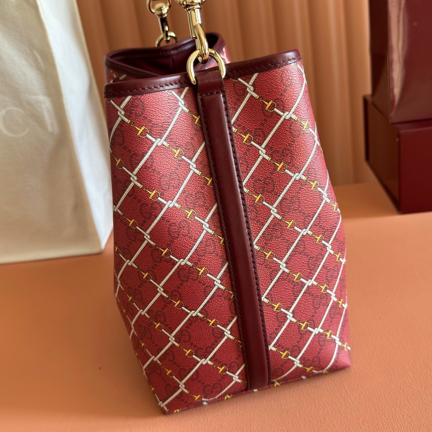 GUCCI 26S GG EMBLEM BUCKET BAG 25 IN DARK RED COATED FABRIC