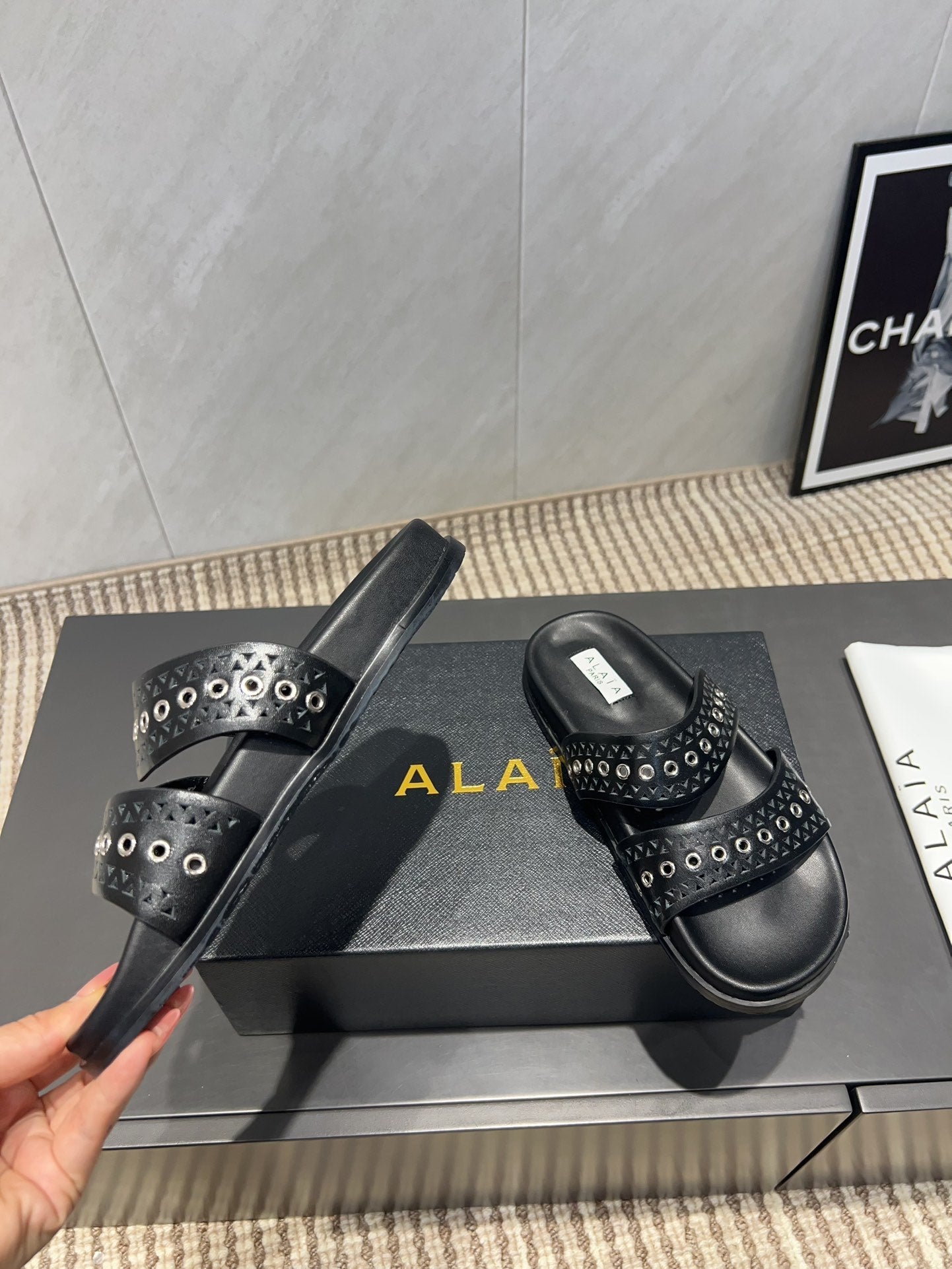 ALAIA DOUBLE-STRAP SANDALS 25S IN BLACK CALFSKIN