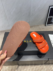 ALAIA DOUBLE-STRAP SANDALS 25S IN ORANGE CALFSKIN