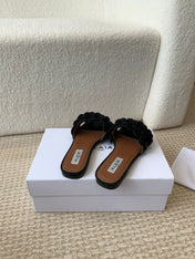 ALAIA FLAT MULE IN BLACK SUEDE