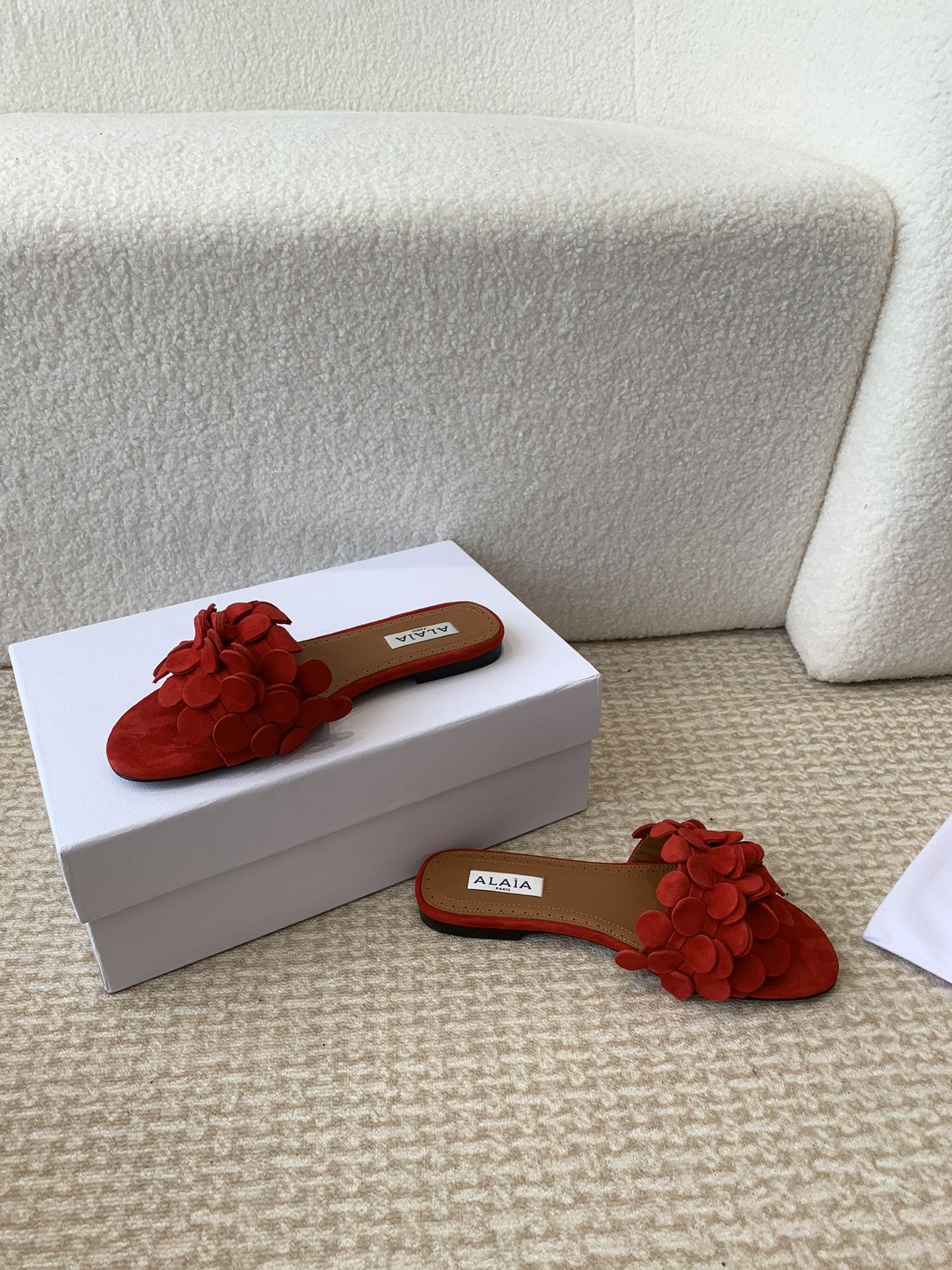 ALAIA FLAT MULE IN CHERRY RED SUEDE