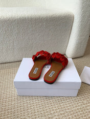 ALAIA FLAT MULE IN CHERRY RED SUEDE