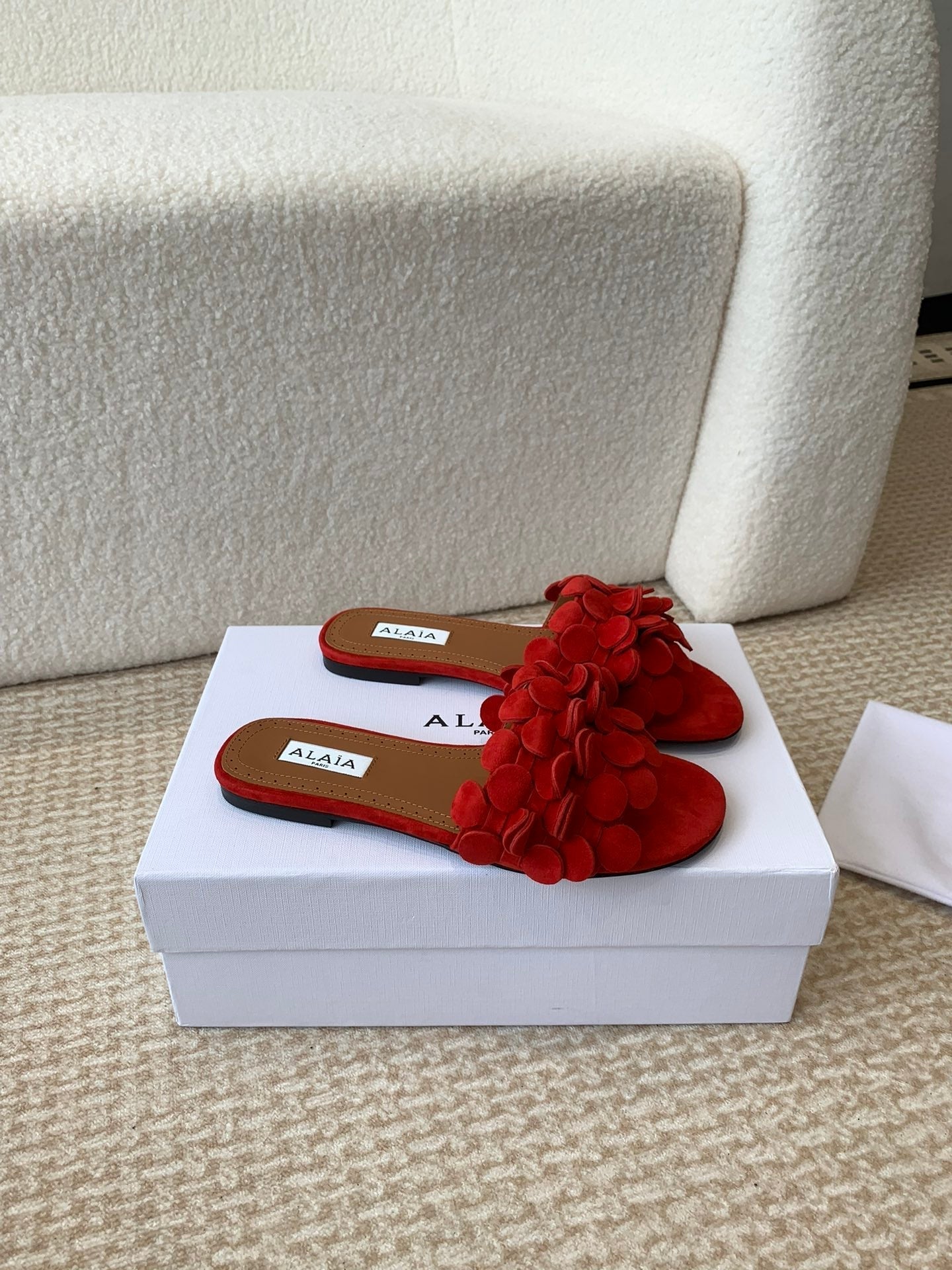 ALAIA FLAT MULE IN CHERRY RED SUEDE