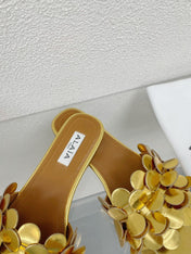 ALAIA FLAT MULE IN GOLDEN GLOSSY LAMBSKIN