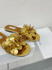 ALAIA FLAT MULE IN GOLDEN GLOSSY LAMBSKIN