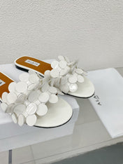 ALAIA FLAT MULE IN WHITE GLOSSY LAMBSKIN