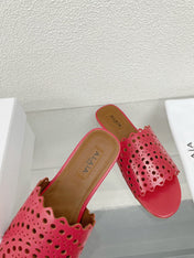 ALAIA VIENNE FLAT MULES IN CHERRY RED LAMBSKIN