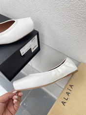ALAIA BALLET FLATS IN WHITE CALFSKIN
