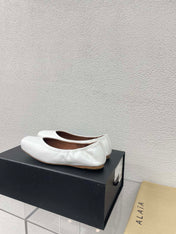 ALAIA BALLET FLATS IN WHITE CALFSKIN
