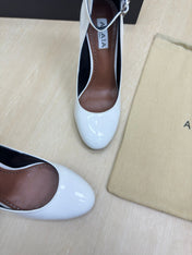 DECOLLETE PUMPS IN WHITE PATENT CALFSKIN