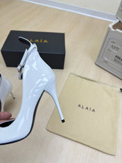 DECOLLETE PUMPS IN WHITE PATENT CALFSKIN