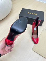 DECOLLETE PUMPS IN CHERRY RED PATENT CALFSKIN