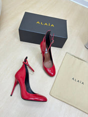 DECOLLETE PUMPS IN CHERRY RED PATENT CALFSKIN