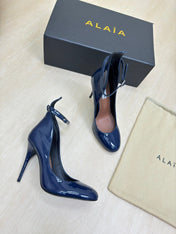 DECOLLETE PUMPS IN NAVY BLUE PATENT CALFSKIN
