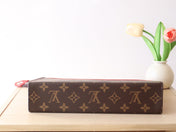 LV 25S POCHETTE VOYAGE 26 IN SARI RED MONOGRAM MACASSAR COATED CANVAS