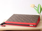 LV 25S POCHETTE VOYAGE 26 IN SARI RED MONOGRAM MACASSAR COATED CANVAS