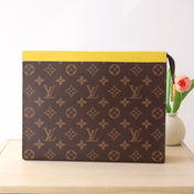 LV 25S POCHETTE VOYAGE 26 IN YELLOW MONOGRAM MACASSAR COATED CANVAS