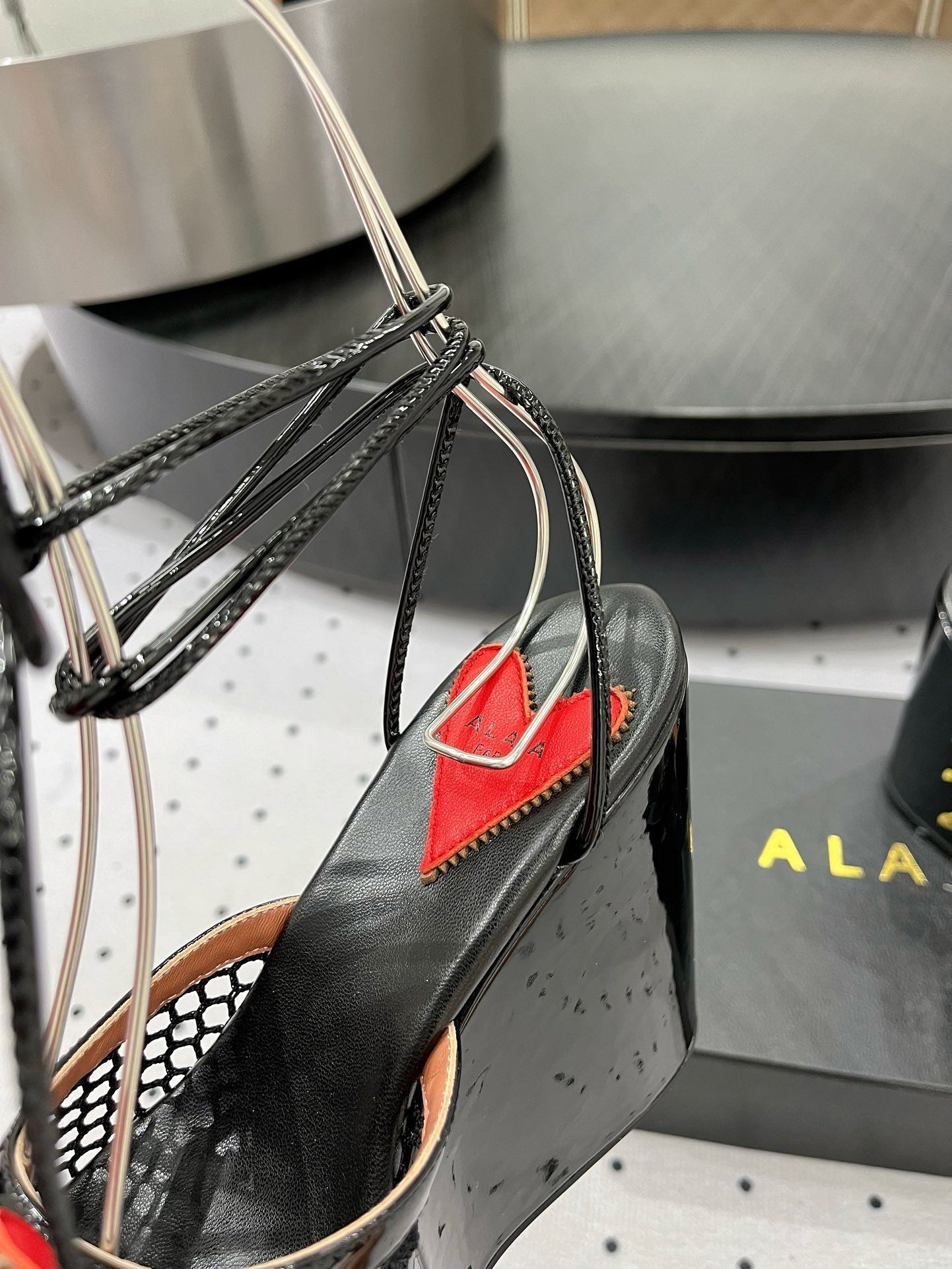 ALAIA BANQUET WEDGE SANDALS IN BLACK LAMBSKIN WITH RED HEART
