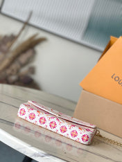 FÉLICIE POCHETTE 21 IN CORAL MONOGRAM TILES CANVAS