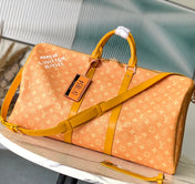 KEEPALL BANDOULIÈRE 55 IN ORANGE MONOGRAM HERITAGE CANVAS