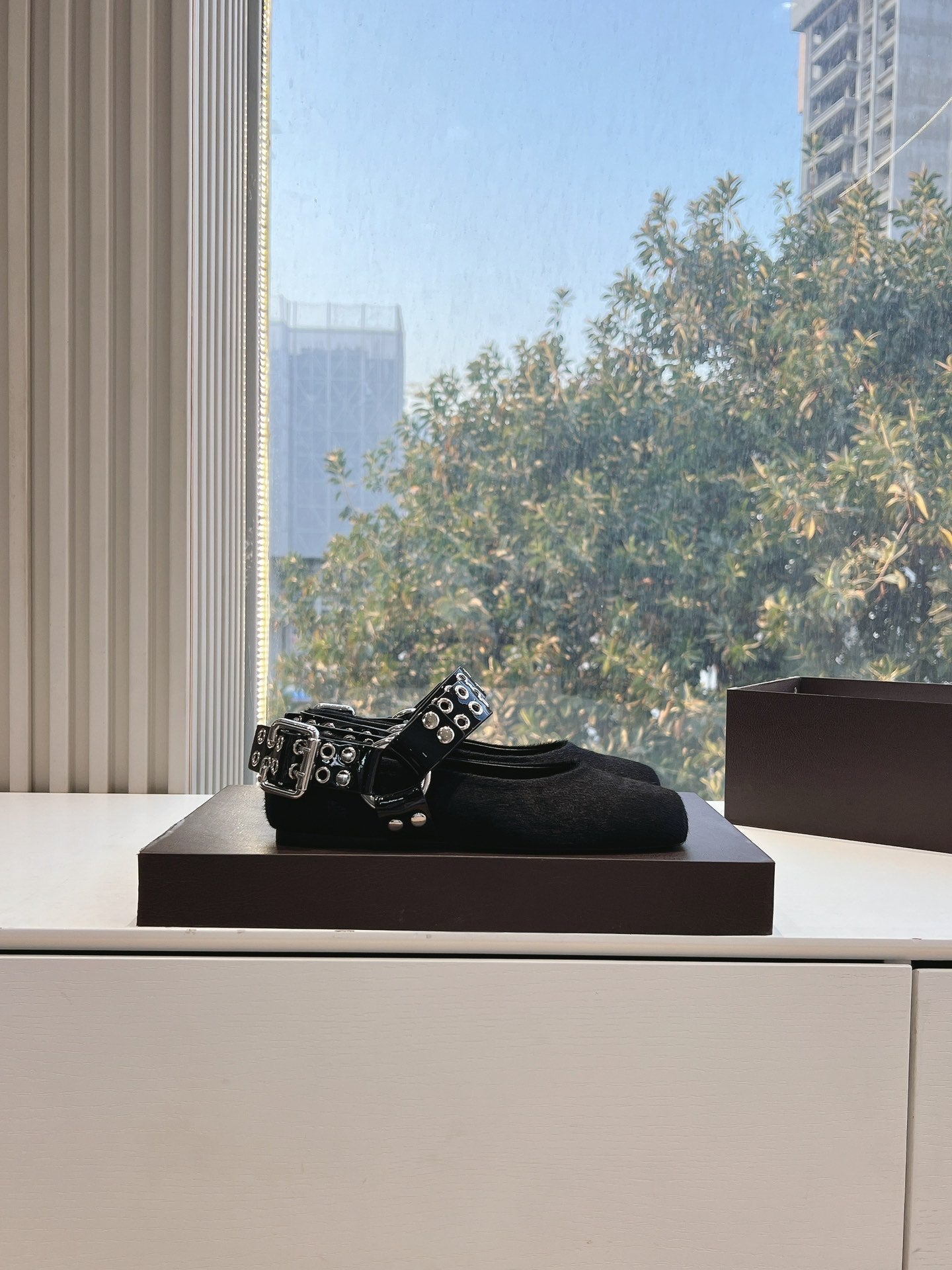 ALAIA 26S FLATS IN BLACK PONY HAIR WITH SILVER STUD STRAP