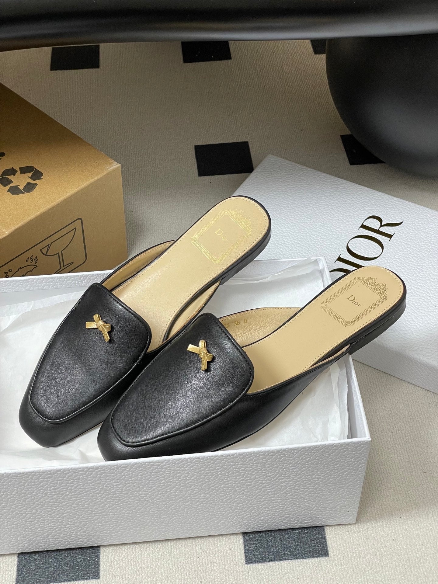 DIOR 26S MULES IN BLACK CALFSKIN WITH BOW