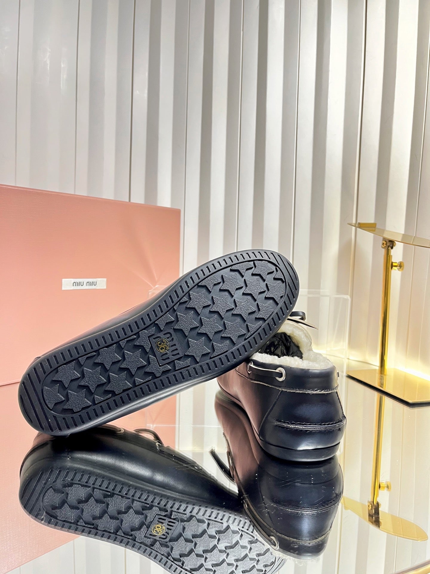 MIUMIU 26S FUR BOAT SHOES IN BLACK CALFSKIN