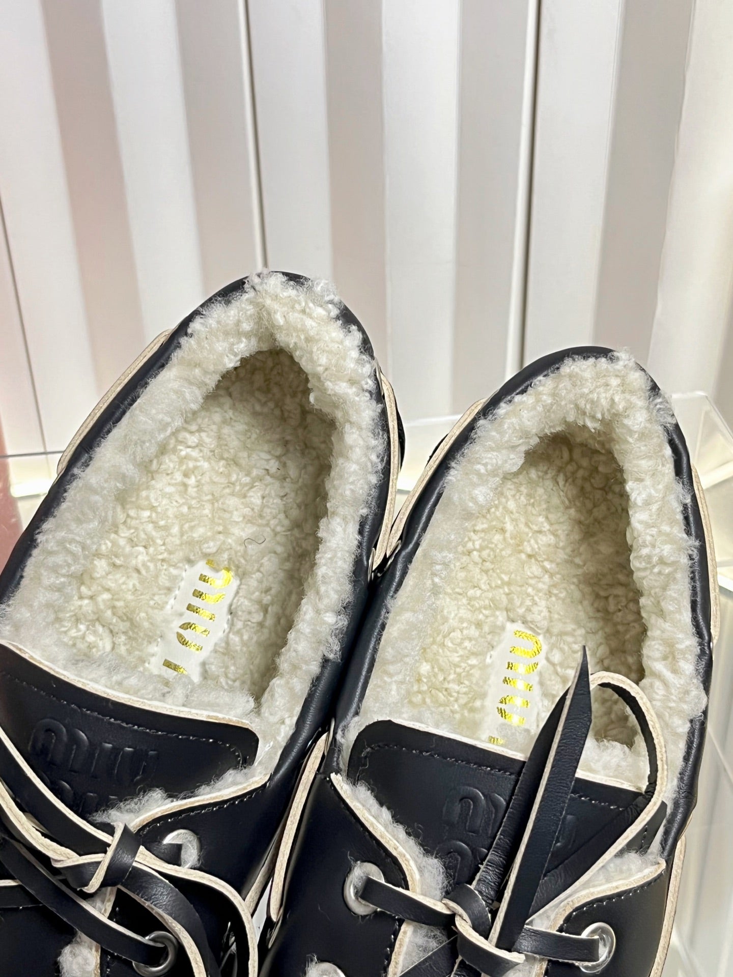 MIUMIU 26S FUR BOAT SHOES IN BLACK CALFSKIN