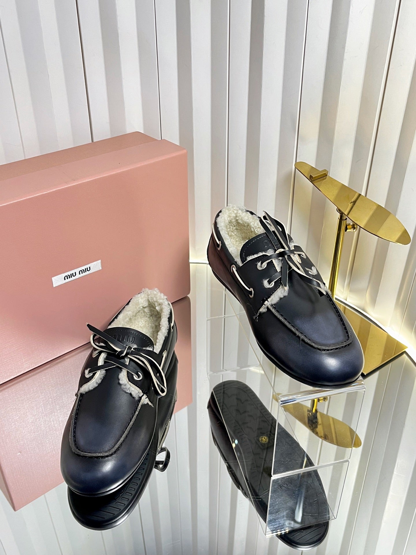 MIUMIU 26S FUR BOAT SHOES IN BLACK CALFSKIN