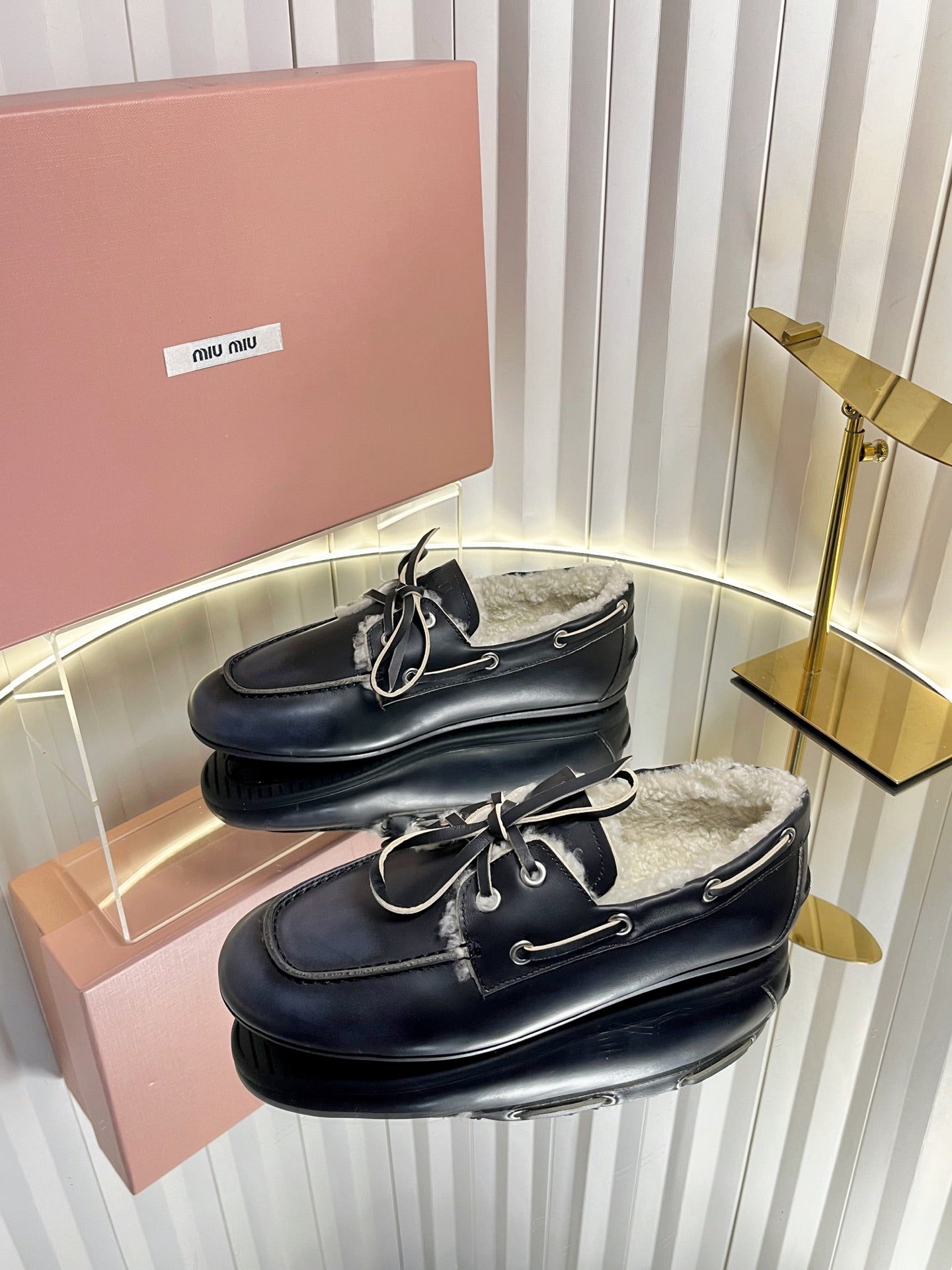 MIUMIU 26S FUR BOAT SHOES IN BLACK CALFSKIN