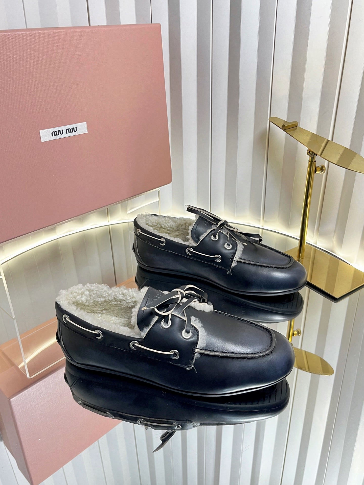 MIUMIU 26S FUR BOAT SHOES IN BLACK CALFSKIN