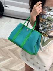 GARDEN PARTY 30CM IN CADMIUM GREEN TOILETS COTTON CANVAS AND GREEN CALFSKIN