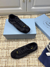 PRADA 26S LOW TOP SNEAKERS IN BLACK NYLON AND SUEDE