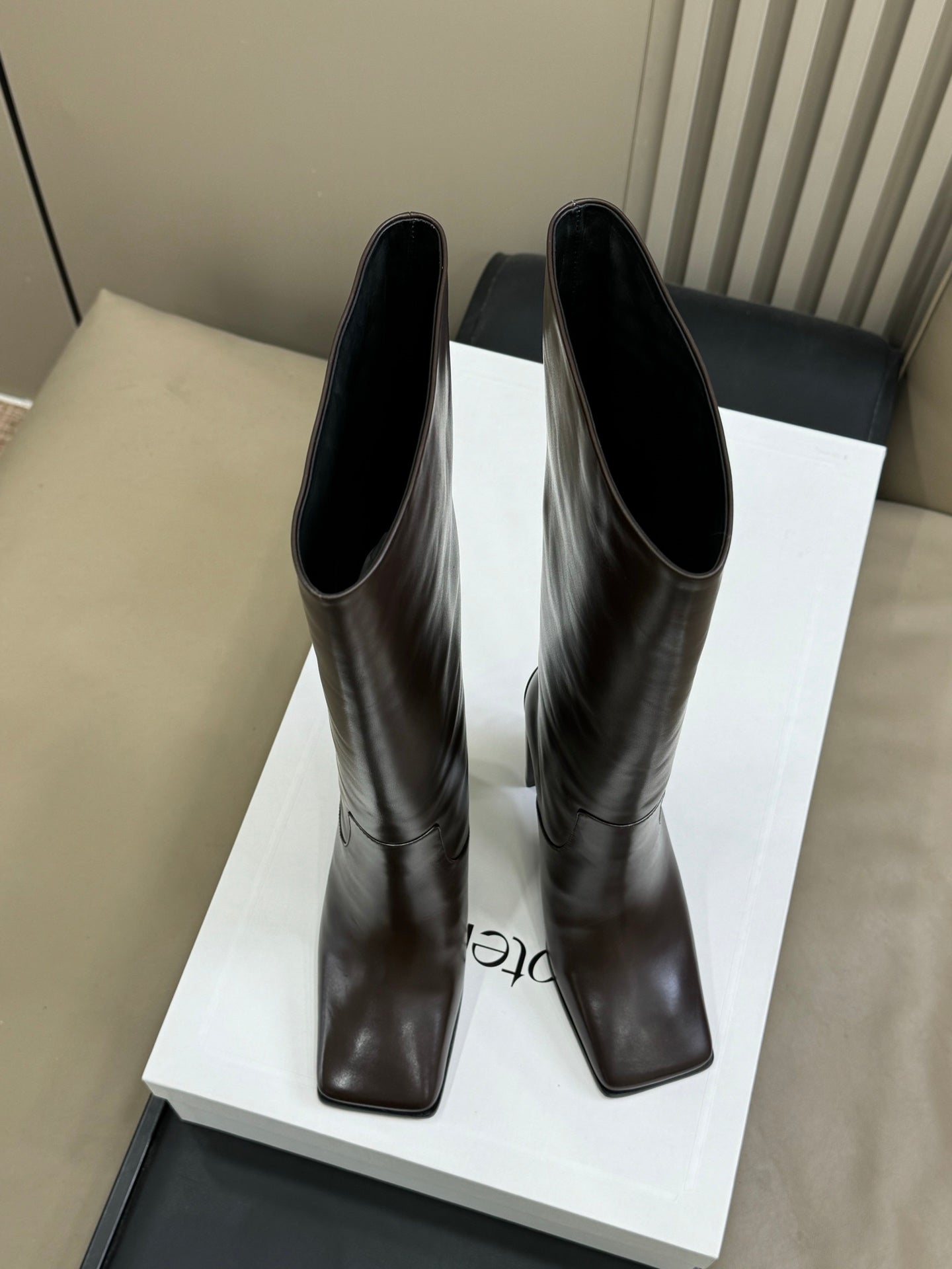 ALAIA 25S KNEE-HIGH SQUARE-TOE BOOTS IN BROWN CALFSKIN