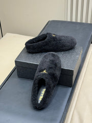 PRADA 25S CLOGS IN BLACK SHEARLING